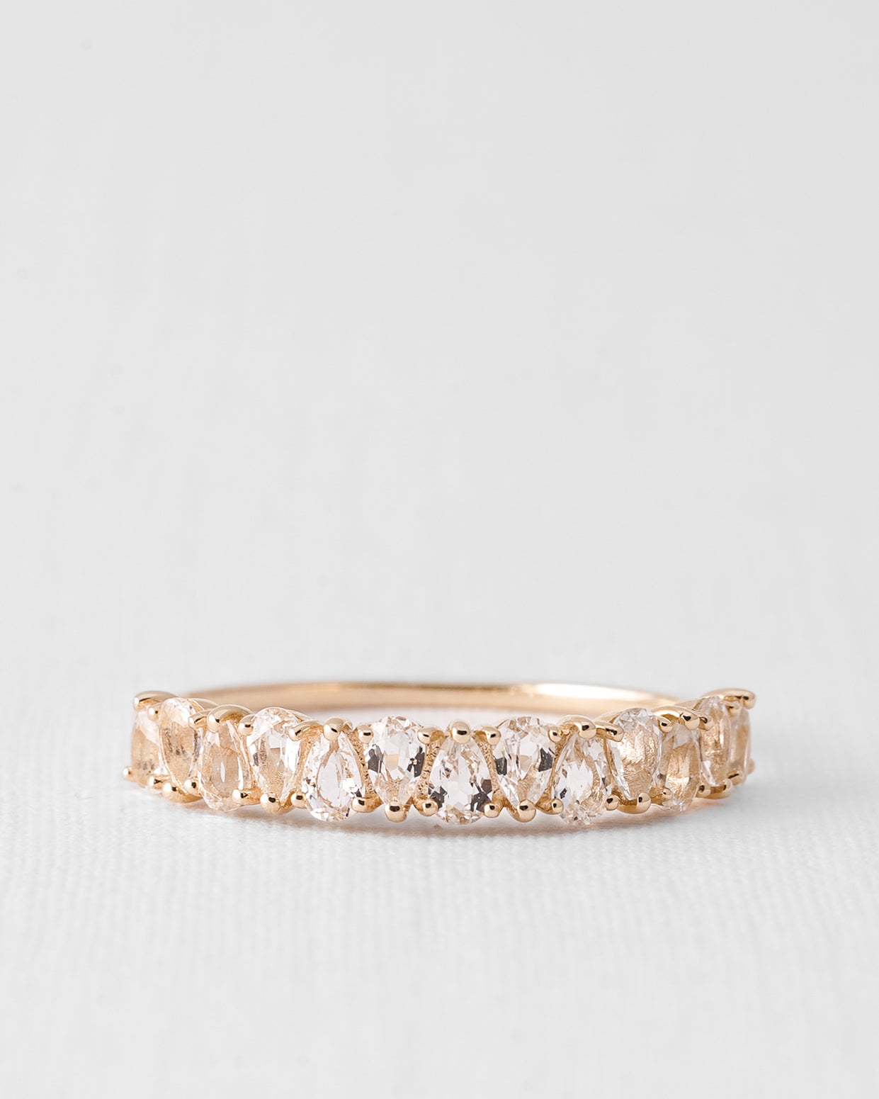 Eirene | 14K White Topaz Half Eternity Pear Cut Ring